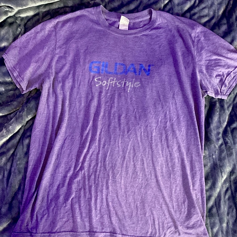 65% polyester 35% cotton. Purple. Worn once.